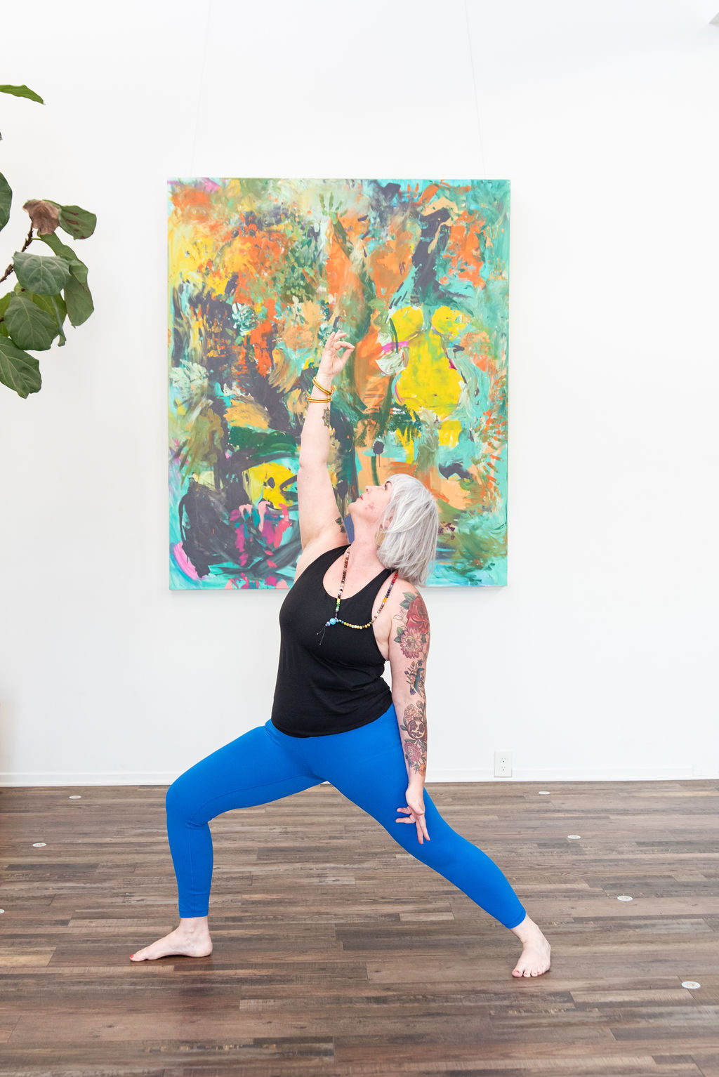 Quinn O'Briant Heller in a yoga warrior pose